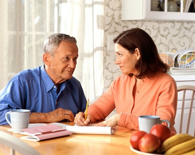 17068-a-woman-and-older-man-sitting-at-a-table-pv (April Blog1).jpg